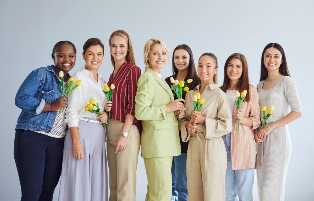 Group of women, posing together for Women's Day.