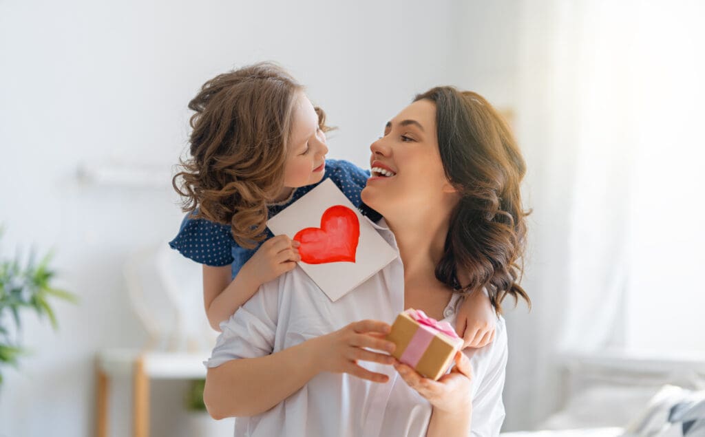 Kid and Mother celebrating Mother's Day.