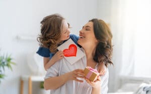 Kid and Mother celebrating Mother's Day.